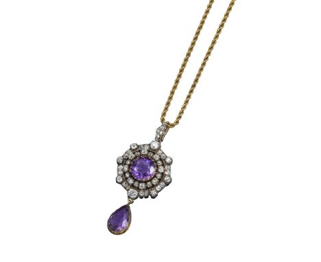 A Victorian amethyst and diamond circular pendant, the circular-cut amethyst set within a surround of alternately large and s