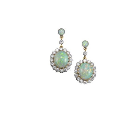 A pair of opal and diamond drop earrings, each oval-shaped cabochon white opal millegrain-set within a surround of round bril