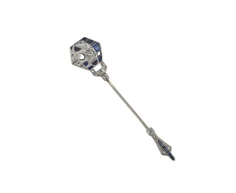 A gem-set jabot pin with an elephant, the diamond-set elephant with an emerald eye and set with small sapphires and diamonds,