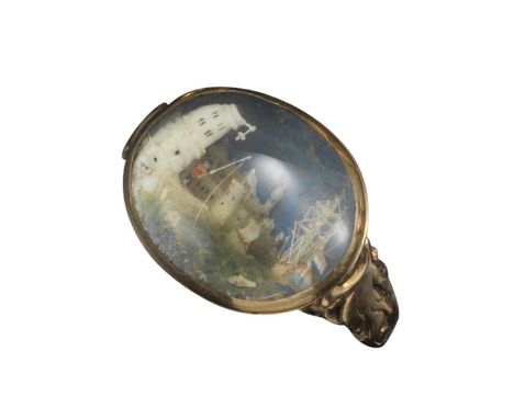 A late 18th-century gold ring mounted with a finely-carved ivory coastal scene, possibly French, depicting a fisherman on the