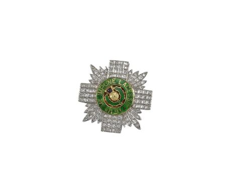 A Regimental brooch for the Scots Guards, set overall with circular-cut diamonds and the motto with green enamel decoration a