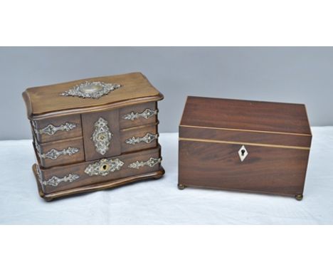 A 19TH CENTURY MAHOGANY TEA CADDY, the hinged lid opening to reveal twin inner covers, the front with ivory escutcheon, raise