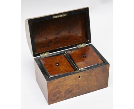 A 19TH CENTURY WALNUT VENEER DOME TOP TEA CADDY, opens to reveal two inner lidded compartments, 23cm wide 