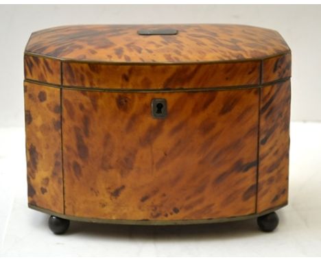 A 19TH CENTURY TORTOISESHELL TEA CADDY of bow fronted canted form, the hinged lid opening to reveal two internal lidded divis