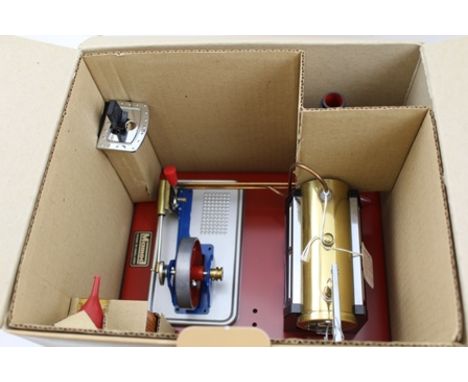 A MAMOD STATIONARY STEAM ENGINE MODEL SP4, on base with fly wheel, in original box (unused) 
