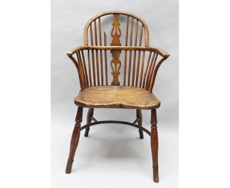 A 19TH CENTURY PART YEW-WOOD PROVINCIAL ARMCHAIR, having low comb back with pierced splat, elm saddle seat, on ring turned su