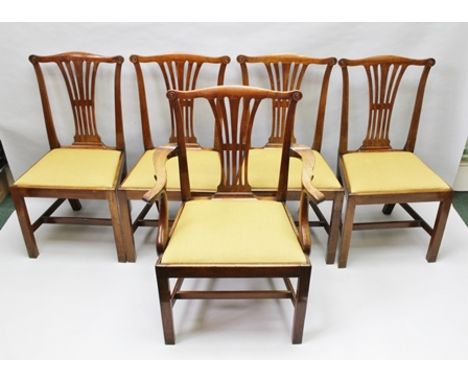 A SET OF FIVE CHIPPENDALE DESIGN MAHOGANY DINING CHAIRS, pierced splat backs with scroll end back crest rail, with drop in se