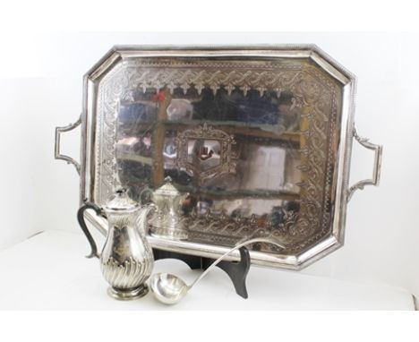 A LATE VICTORIAN LARGE SILVER-PLATED TEA TRAY of rectangular form with canted corners, with two handles, decorative border an