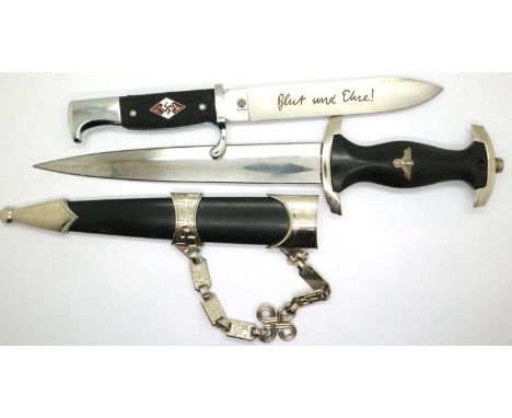 A replica SS presentation dagger with scabbard and suspension chain with a replica Hitler Youth dagger (2). P&amp;P Group 2 (