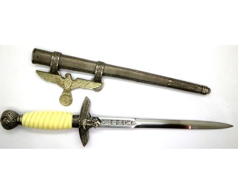 A replica Luftwaffe Officers Parade dagger with steel scabbard. P&amp;P Group 2 (£18+VAT for the first lot and £3+VAT for sub