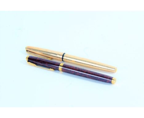 Parker - two fountains pens, the first with wood effect case and 14k nib, the second with 12ct rolled gold case (2)