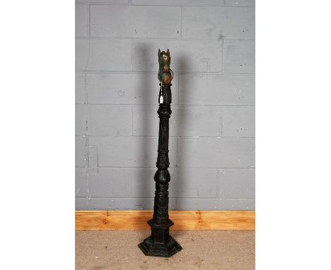 Cast metal post, mounted with a horses head and loop, 133cm tall