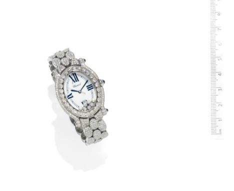 A diamond 'Happy Sport' watch,  by ChopardThe oval dial with Roman chapters to the quarters and an outer minutes track betwee