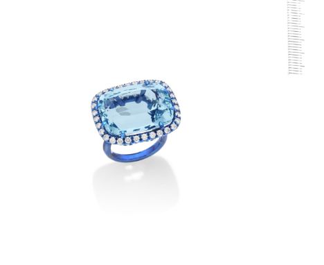 An aquamarine and diamond ring, by Margherita BurgenerThe cushion-shaped aquamarine within a surround of brilliant-cut diamon