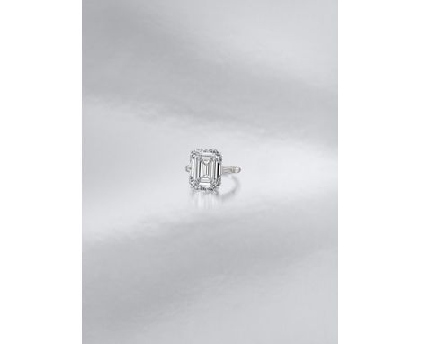 A diamond single-stone ringThe step-cut diamond, weighing 7.46 carats, between tapered baguette-cut diamond shoulders, ring s