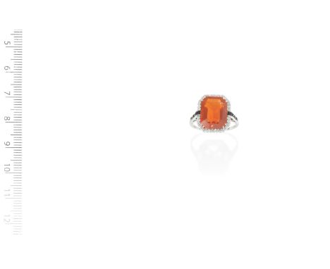 An Art Deco fire opal, onyx and diamond ring,  circa 1920The step-cut fire opal within a surround of single-cut diamonds, bet