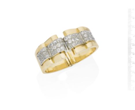 A diamond cuff, circa 1935The front of undulating design and with a raised central section pavé-set with old brilliant-cut di