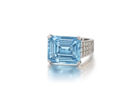 An aquamarine and diamond ring, by CartierThe rectangular step-cut aquamarine within pavé-set brilliant-cut diamond shoulders