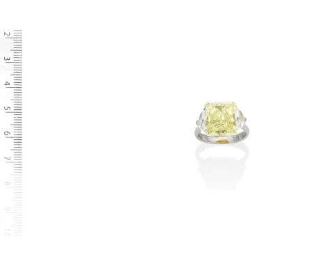 A fancy-coloured diamond and diamond ringThe radiant-cut diamond, weighing 11.30 carats, of yellow tint, between demi-lune di
