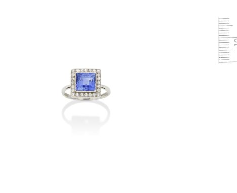 An Art Deco sapphire and diamond ring, Circa 1930The step-cut sapphire within an old brilliant-cut diamond surround, sapphire