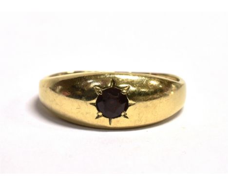 A 9CT GOLD, GARNET GYPSY RING The ring set with a single star set garnet, worn 375 hallmark to the shank, ring size Q, weight