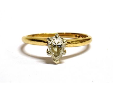 14KT GOLD, PEAR CUT DIAMOND SOLITAIRE RING The ring set with a pear cut diamond measuring approx. 6mm X 4 mm on a yellow gold