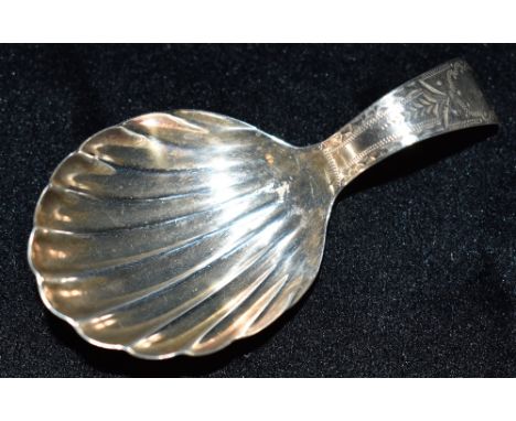 A 19TH CENTURY SILVER TEA CADDY SPOON the spoon with curved handle with bright cut pattern and shell bowl, hallmarked with Li