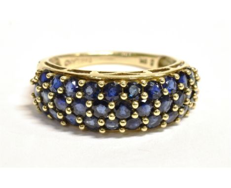 A 9CT GOLD SAPPHIRE CLUSTER RING  The cluster made up of a triple row of small near black sapphires, cluster width 0.9cm, the