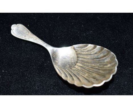 A LATE VICTORIAN SILVER TEA CADDY SPOON The spoon with Albany tip, bright cut pattern handle and shell bowl, hallmarked for S