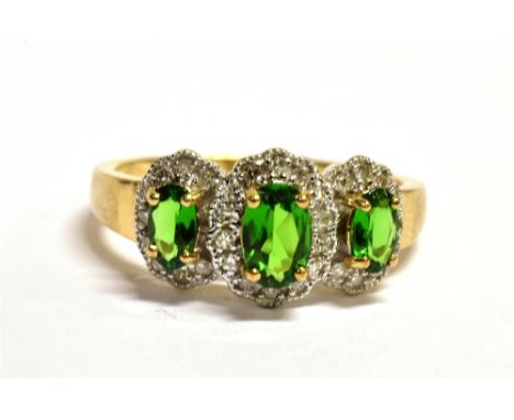 QVC 9CT GOLD, DIAMOND GEM SET TRILOGY RING The ring set with three green graduated oval gemstones in a diamond accent mount, 