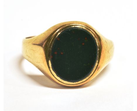 A GREEN BLOODSTONE SIGNET RING The shank with worn markings assessed as 9ct gold, ring size X, weight 6.6g approx