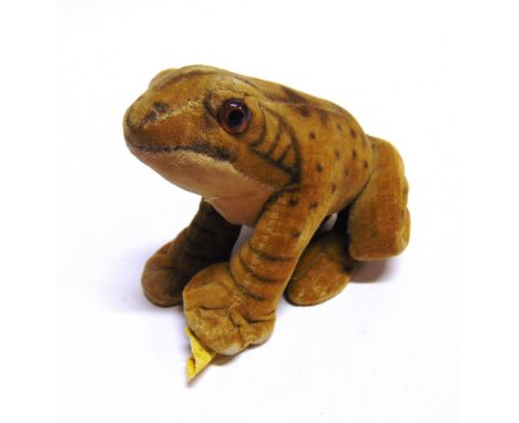 A STEIFF SOFT TOY FROG  with orange glass eyes, sprayed markings, and a button to front left foot, 9cm long.