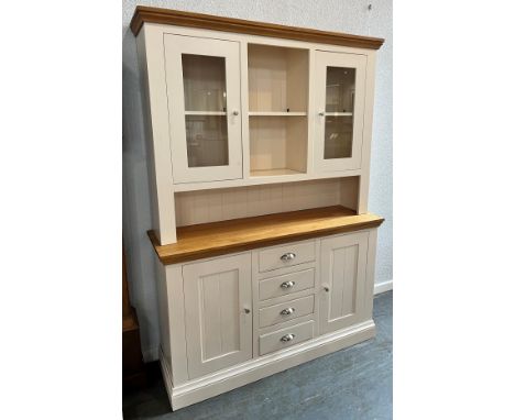 A CONTEMPORARY LIGHT OAK AND PART PAINTED DRESSER  the upper section with pair of glazed doors, base with four drawers flanke