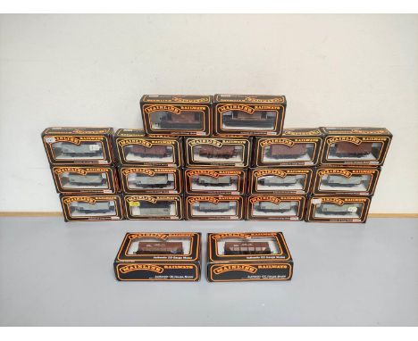 Mainline. Nineteen boxed 00 gauge freight rolling stock wagons and hoppers to include eleven Steel Mineral Wagons 37-133, two