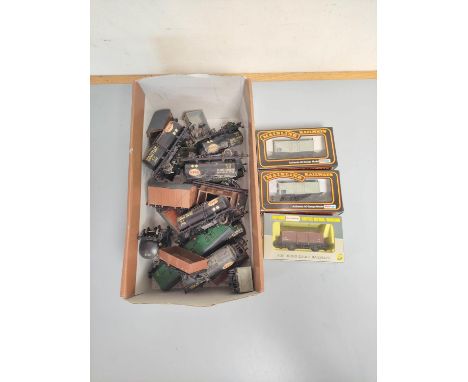 Box containing a collection of 00 gauge rolling stock to include Esso tankers, covered wagons and others. Also to include two