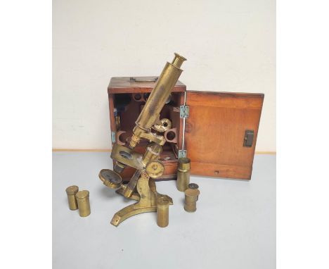 A monocular microscope by James How, London, c1850, signed on the foot ''James How, 2 Foster Lane London''. Gilt brass constr