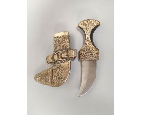 Early 20th century Arabic unmarked white metal Jambiya dagger with repousse mounts and horn handle.&nbsp; 