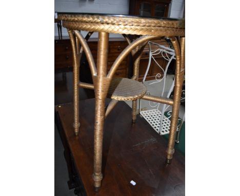 A vintage circular top occasional table having Lloyd Loom frame and undertier, diameter approx. 55cm