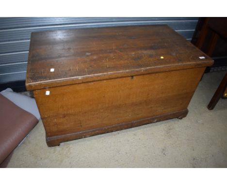 A 19th Century scumbled pine blanket box having internal candle box and double drawer, and metal handles to end, and a select