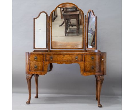 An early to mid 20th Century burr walnut dressing table , of kidney shaped design having triple mirror, two one two drawer co