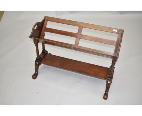 An early 20th Century mahogany book trough of slatted design, on turned frame with undershelf, width approx. 83cm