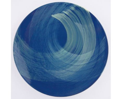 A Poole Studio Pottery charger,blue wash pattern designed by Charlotte Mellis, 1997, diameter 35cm.