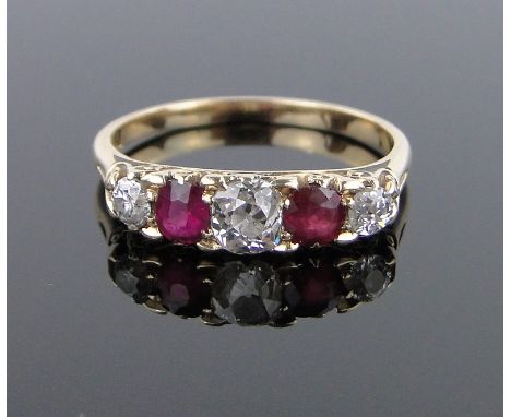 An 18ct gold 5 stone ruby and diamond ring,setting width 16mm, size P.