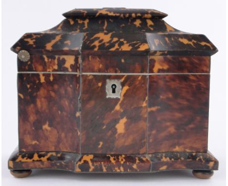 A 19th century tortoiseshell tea caddy,shaped top with inner lids, length 19cm.