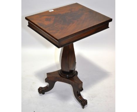 A 19th century mahogany music stand,with rising top, shaped centre column and raised tripod feet, width 1'8", height 2'5", de