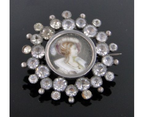 A Victorian miniature painted portrait of a lady,in unmarked paste set frame, diameter 35mm.
