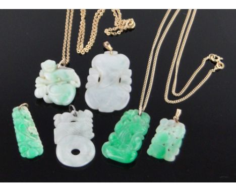 A group of Chinese carved and pierced jade pendants,with several gold chains, (6).