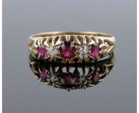 An 18ct gold 5 stone ruby and diamond set ring,size N.