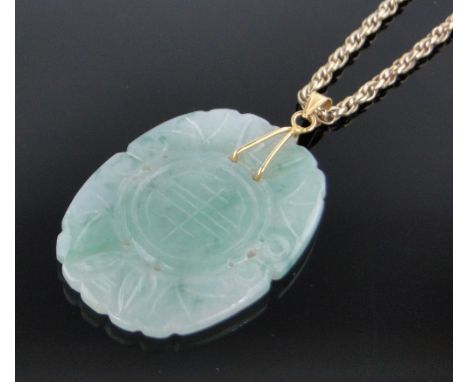 A Chinese relief carved and pierced jade pendant,length 42mm on unmarked gold chain.