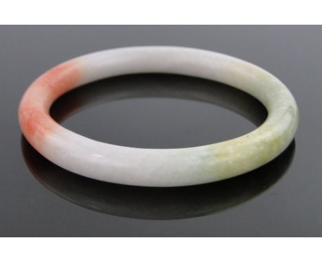 A Chinese coloured jade bangle.